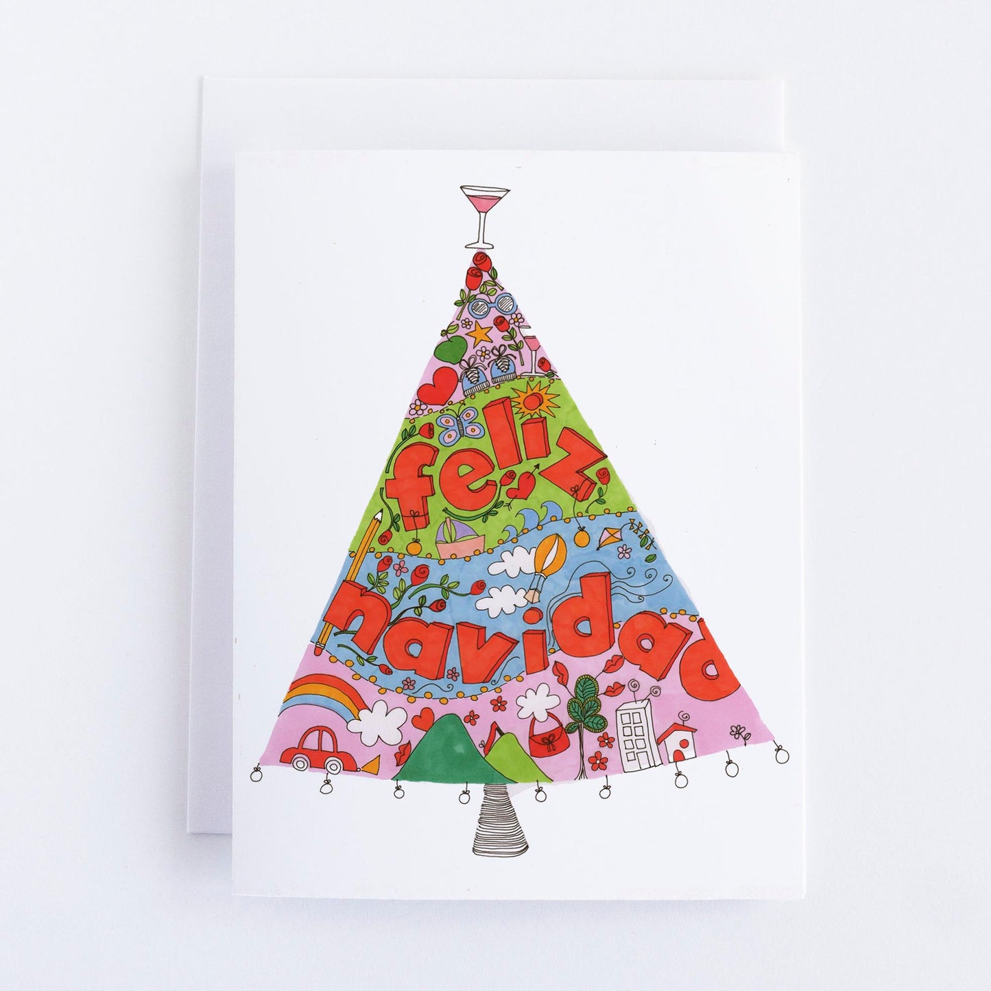 Colorful Christmas tree-shaped card with 'feliz navidad' text on a white background