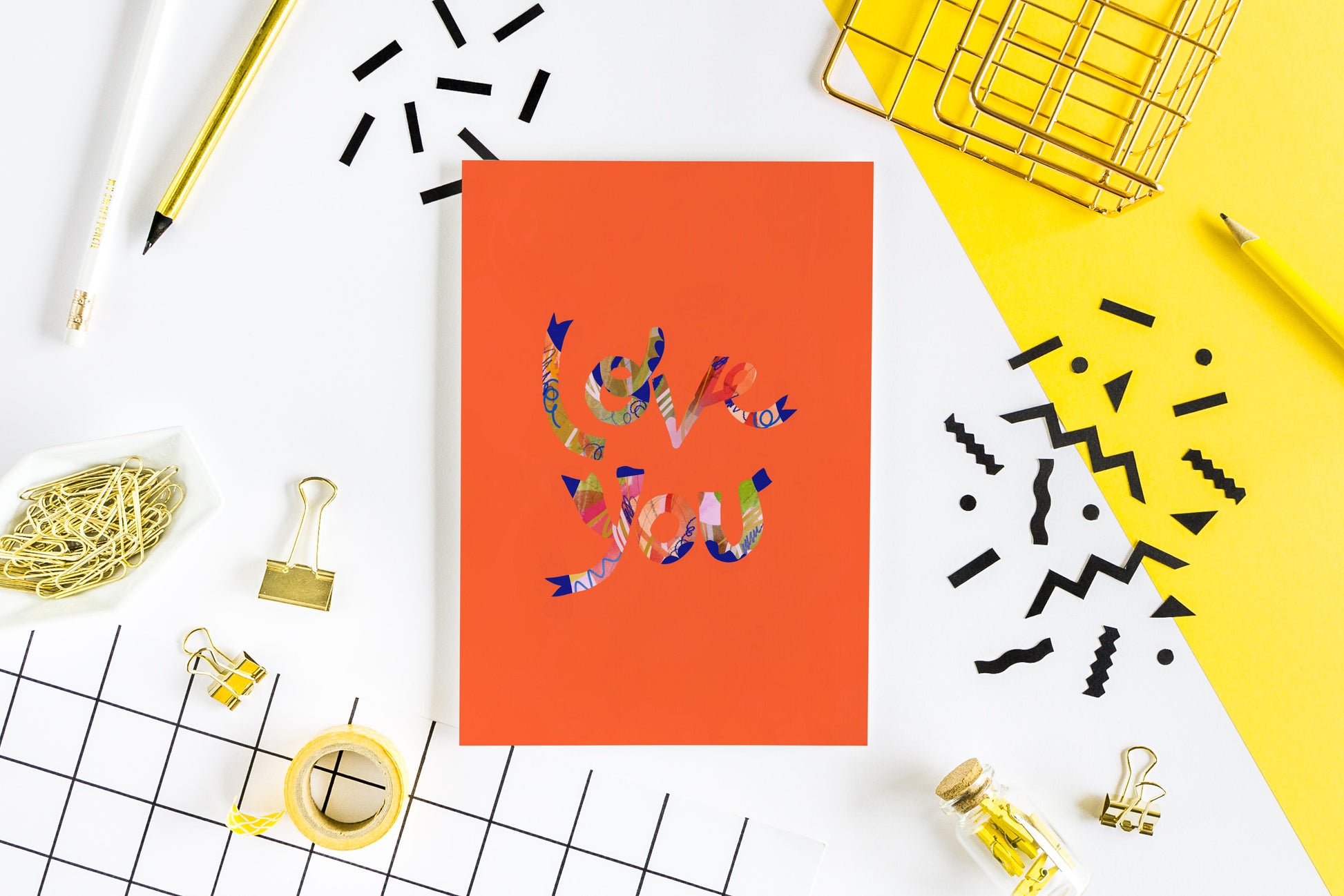 greeting card with an orange background with colorful text that reads love you