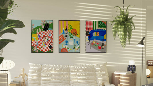Vibrant art print of a red checkered picnic blanket with an Igloo cooler, Uno cards, wine, and fruit. Bold summer-themed wall decor.