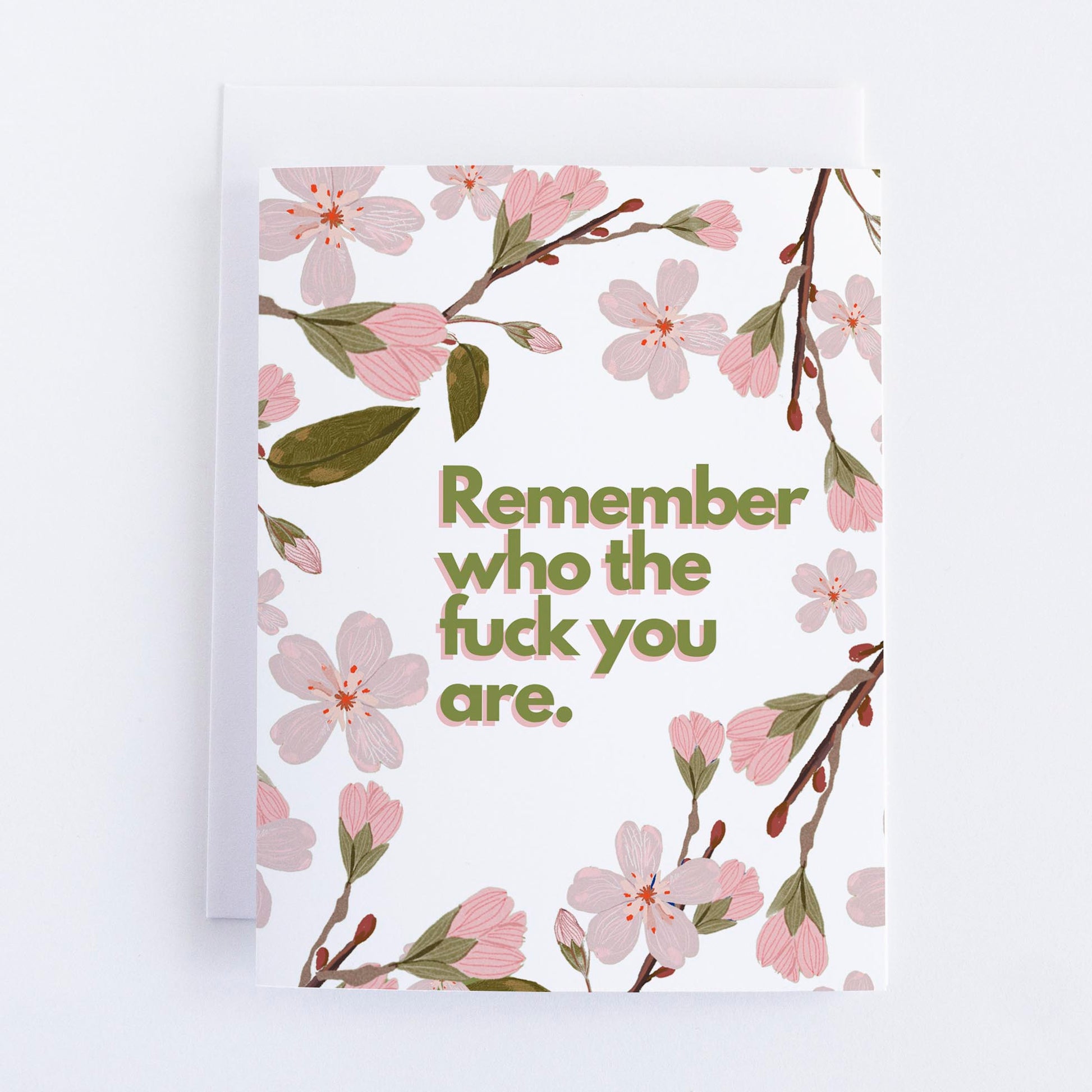 A greeting card with a floral design and the text 'Remember who the f*** you are' printed in the center.