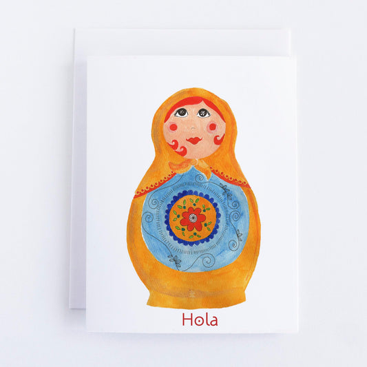 Colorful illustration of a Russian nesting doll with 'Hola' text on a white background