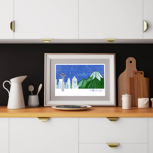 This seattle washington art print is framed in a kitchen counter