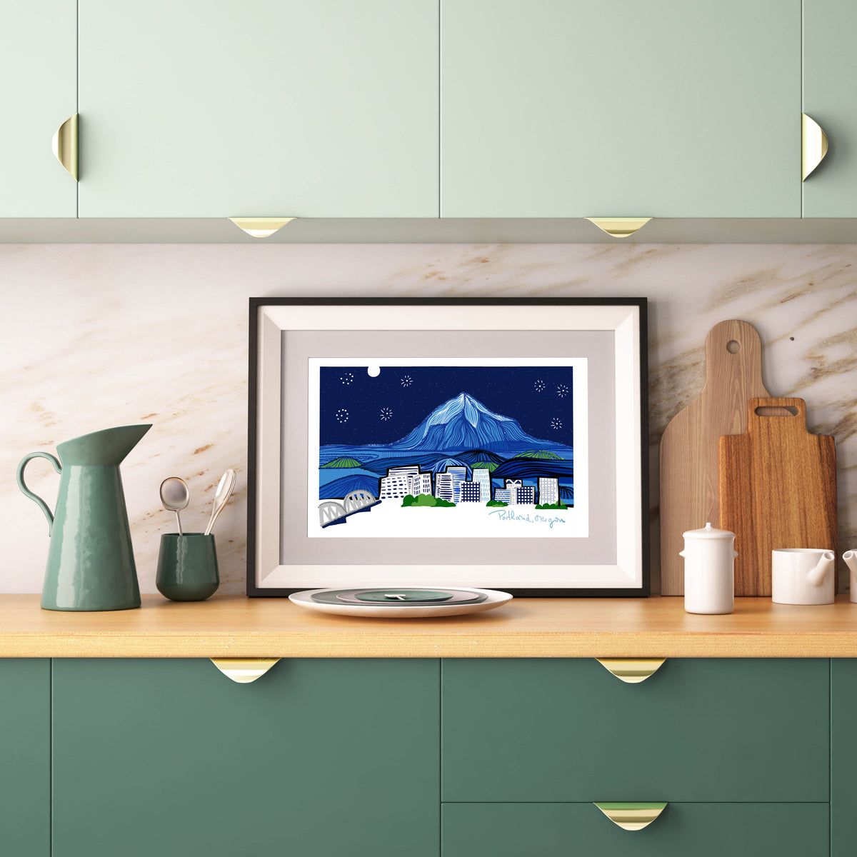 Framed portland oregon skyline featured in a green kitchen